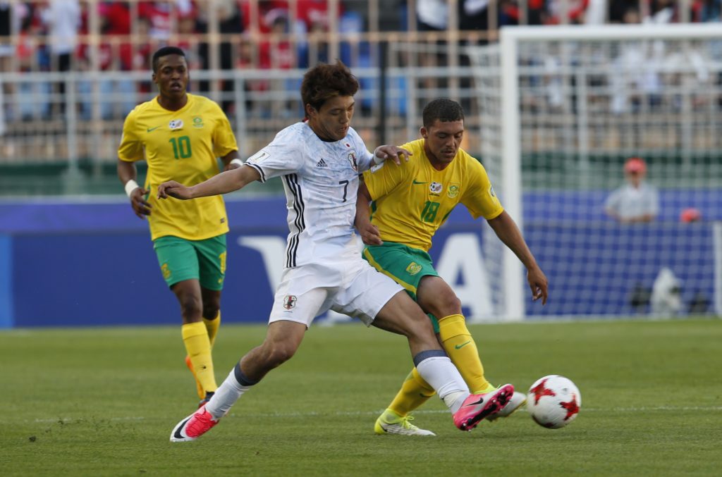 Ritsu Doan vies for the ball with Grant Margeman