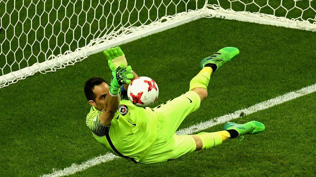 Claudio Bravo of Chile saves Portugal's penalty