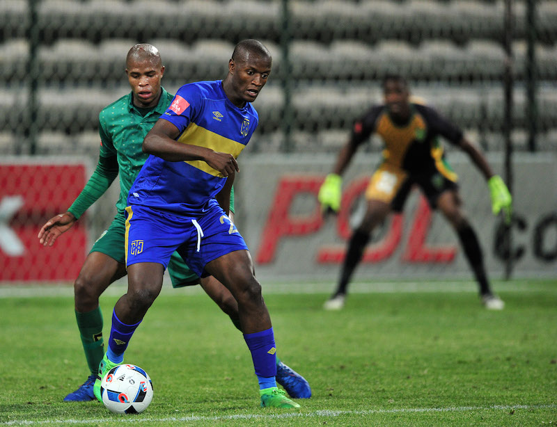 Judas Moseamedi holds the ball up ahead of Romario Dlamini