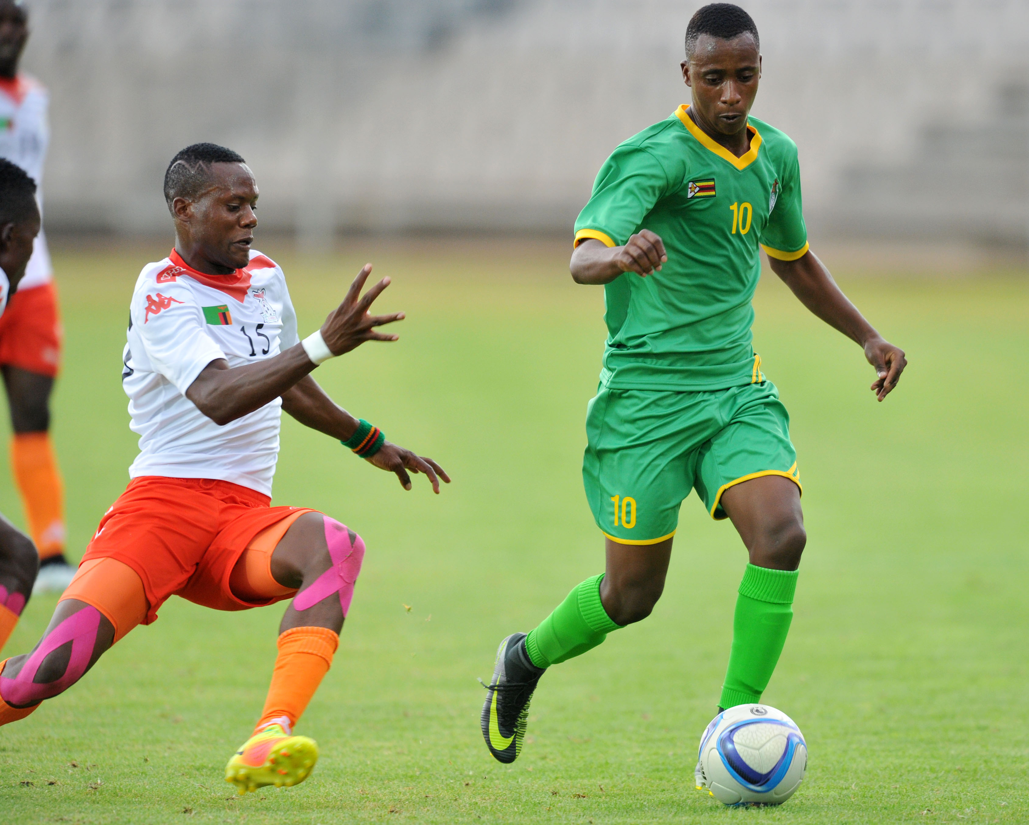 Bukhosi Sibanda tackled by Boyd Musonda