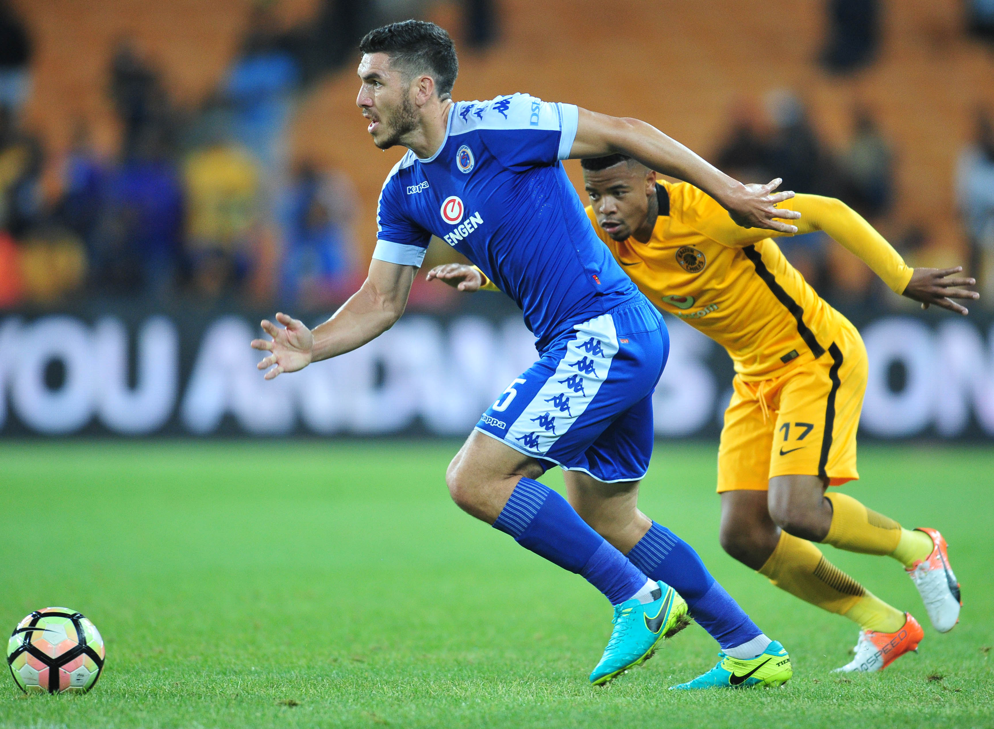 Michael Boxall challenged by George Lebese