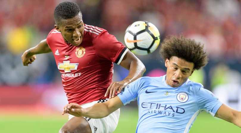 Antonio Valencia of Manchester United challenges Leroy Sane of Manchester City.