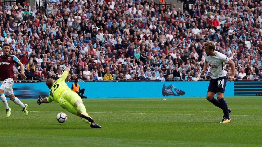 Harry Kane slotting the ball past Joe Hart