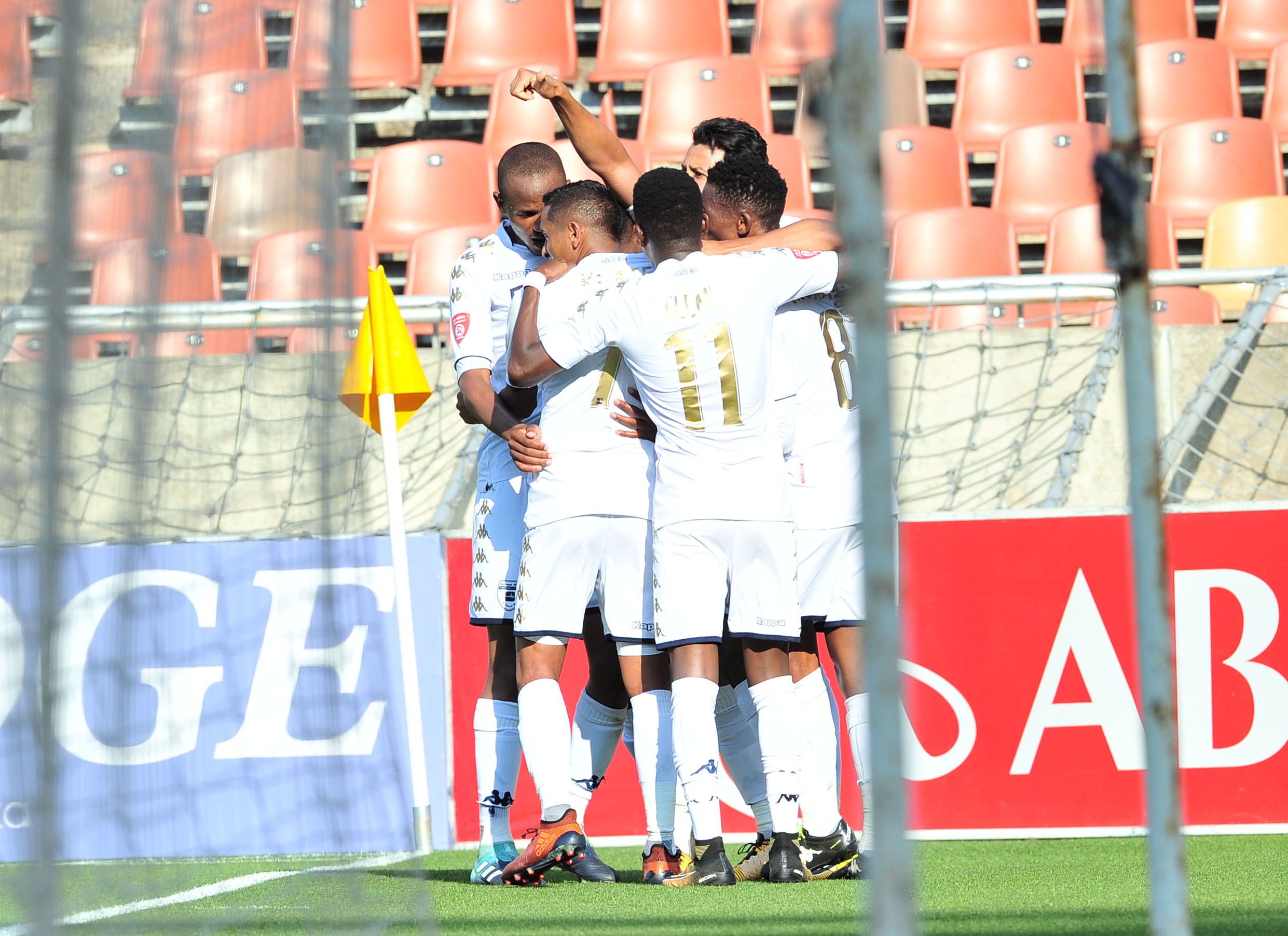 Vincent Pule celebrates a goal with teammates