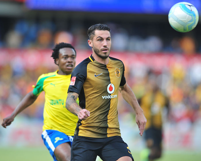 Daniel Cardoso challenged by Percy Tau