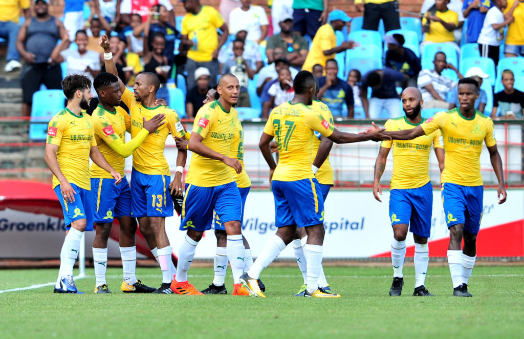 Tiyani Mabunda celebrates his goal with teammates