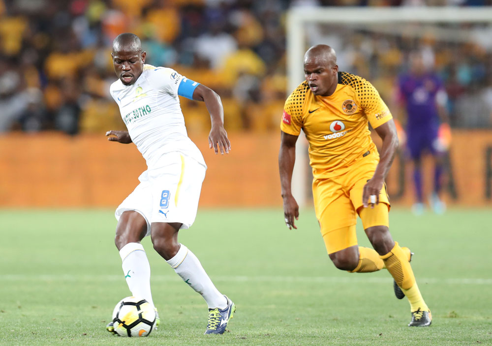 Hlompho Kekana of Mamelodi Sundowns challenged by Willard Katsande of Kaizer Chiefs.