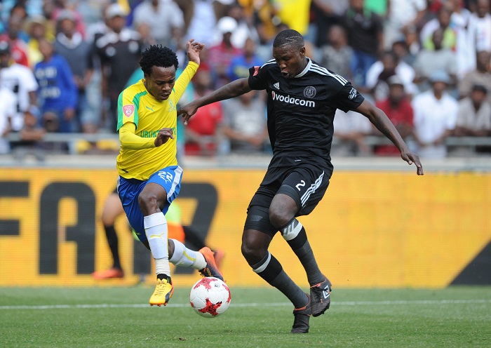 Percy Tau is challenged by Ayanda Gcaba