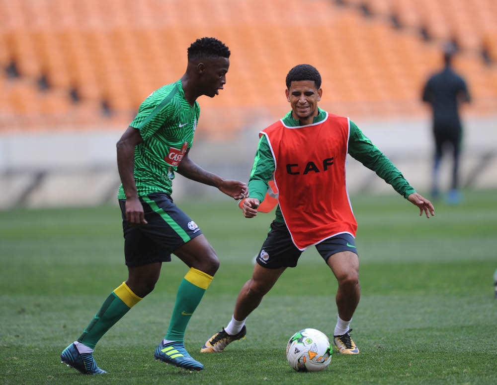 Phakamani Mahlambi challenges Keagan Dolly for the ball