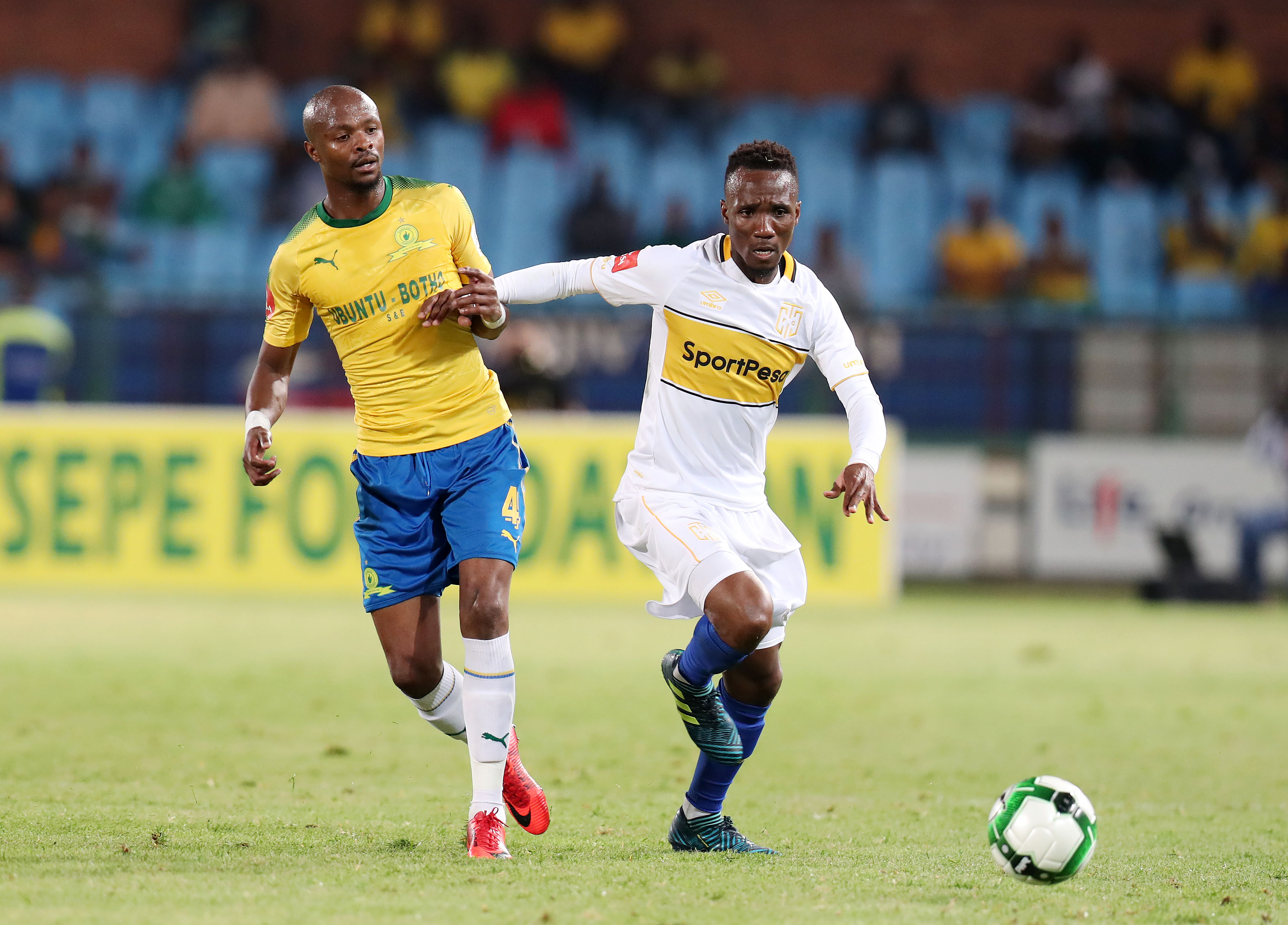 Teko Modise challenged by Tebogo Langerman