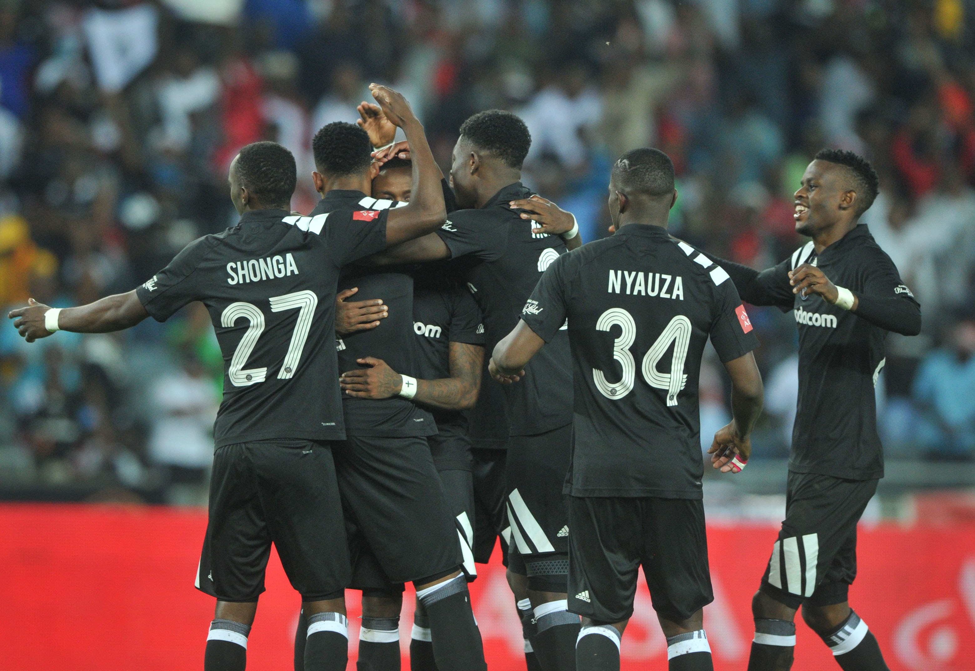 Happy Jele celebrates his goal with teammates