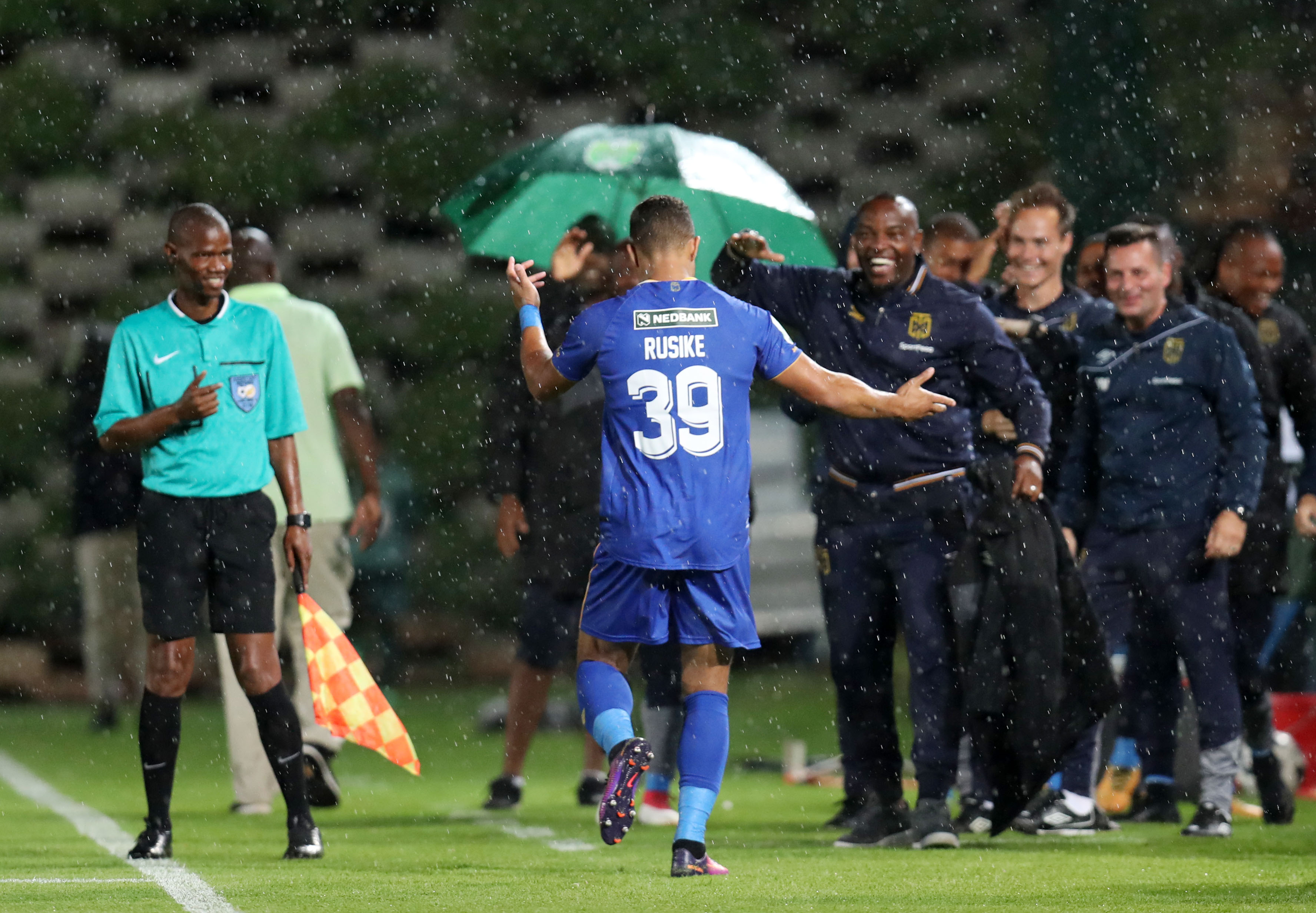 Matthew Rusike celebrates his goal with Benni McCarthy