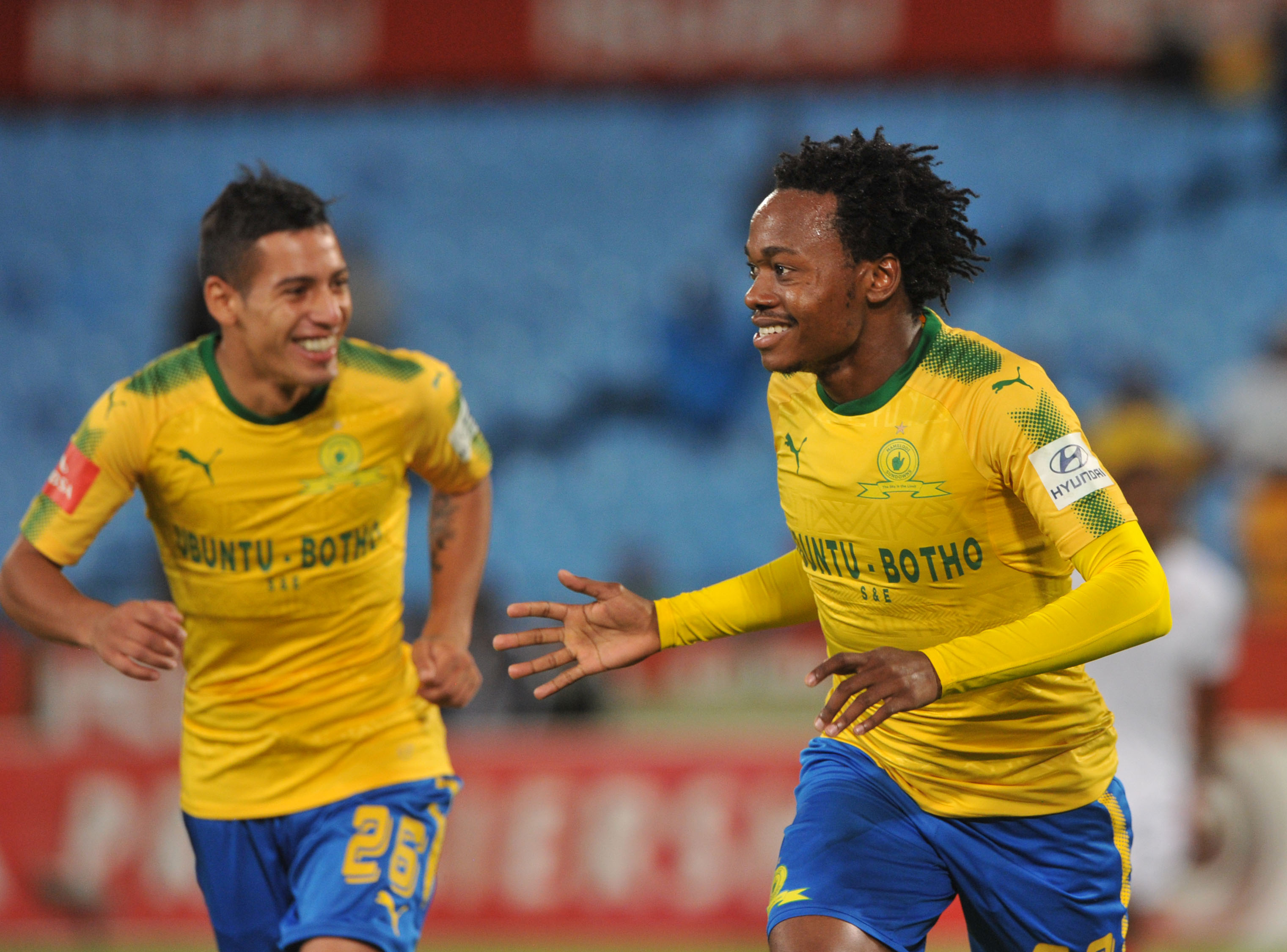 Percy Tau celebrates his goal with Gaston Sirino