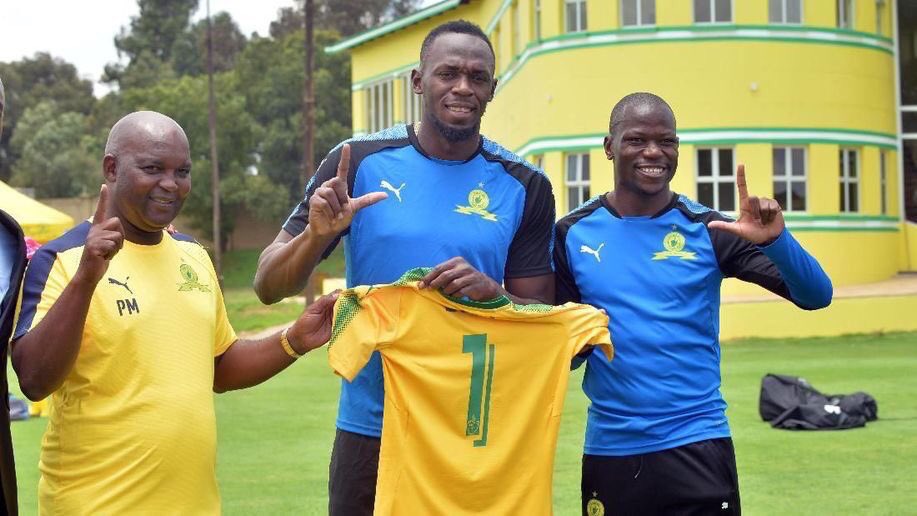 Usain Bolt with Pitso Mosimane and Hlompho Kekana