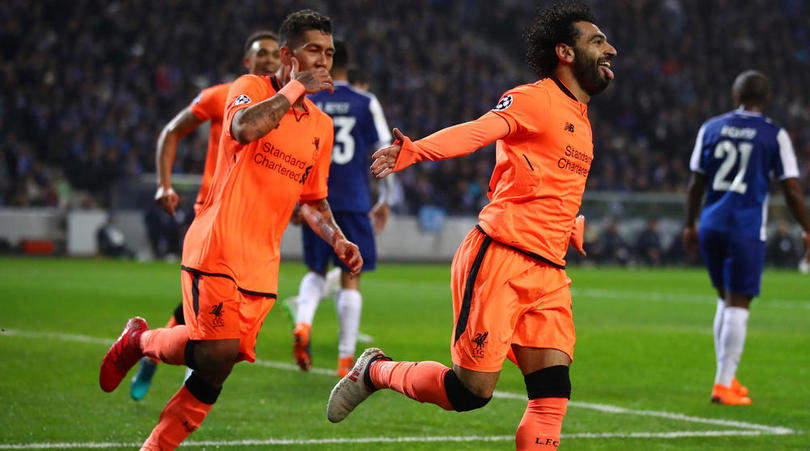 Mohamed Salah celebrates scoring the second goal with Roberto Firmino