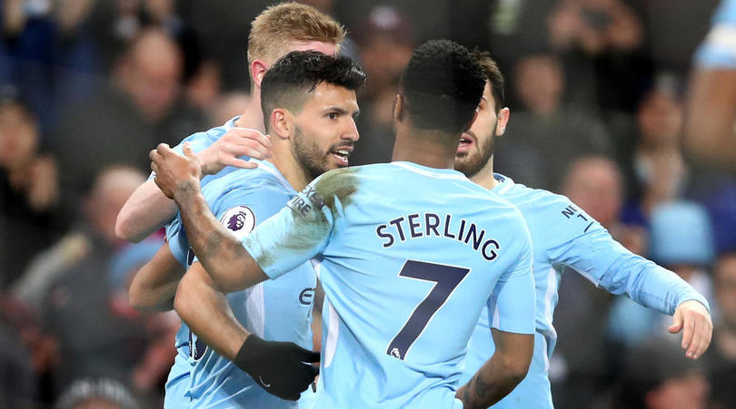 Sergio Aguero celebrates with teammates after scoring his third goal