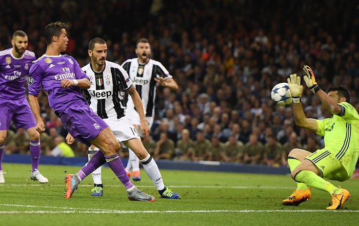 eal Madrid forward Cristiano Ronaldo beats Juventus goalkeeper Gianluigi Buffon in the 2017 UEFA Champions League final.