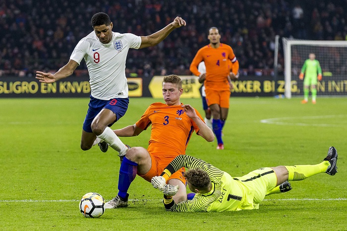 Marcus Rashford from England duels with Matthijs de Ligt and keeper Jeroen Zoet from the Netherlands during the friendly.