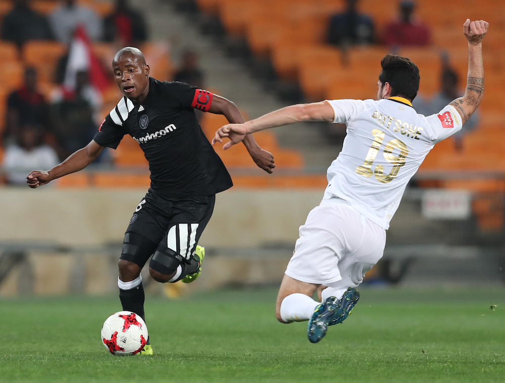 Roland Putsche tackles Thabo Matlaba for the ball