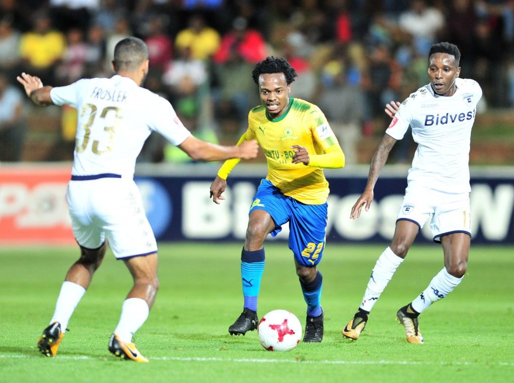 Percy Tau challenged by Reeve Frosler and Elias Pelembe