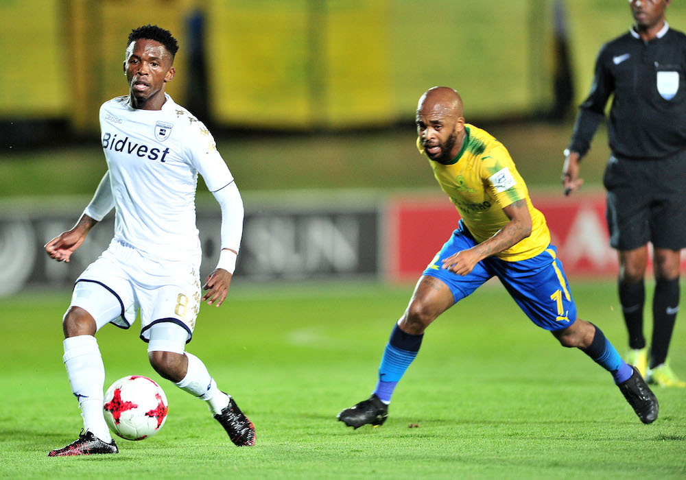 Thabang Monare challenged by Oupa Manyisa