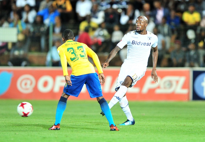 Sifiso Hlanti of Bidvest Wits challenged by Khama Billiat of Mamelodi Sundowns.