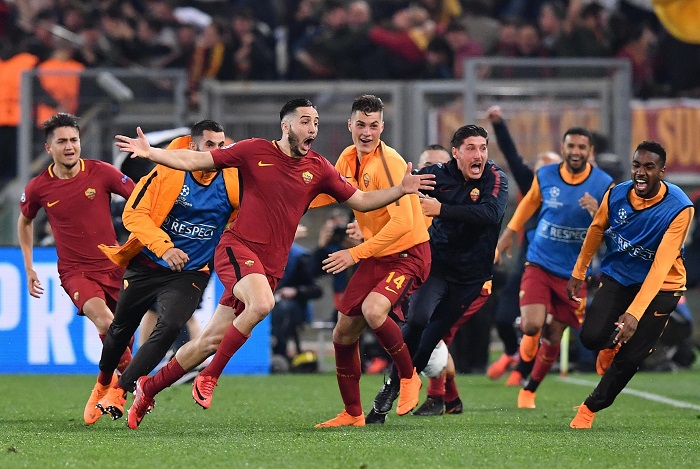 Roma's Kostas Manolas celebrates with teammates after scoring