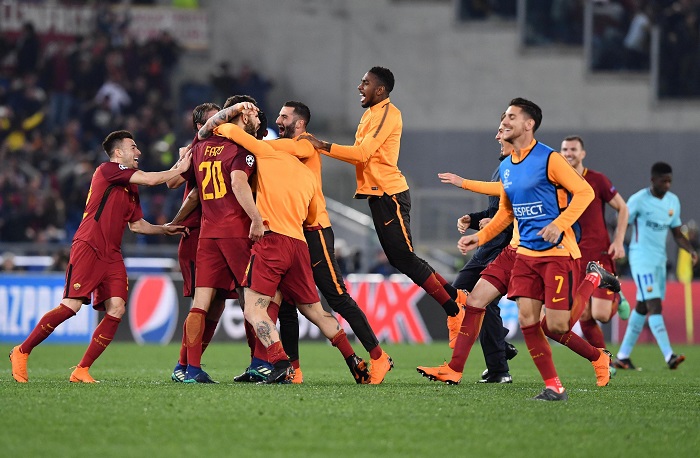 Roma's players celebrate knocking out Barcelona.