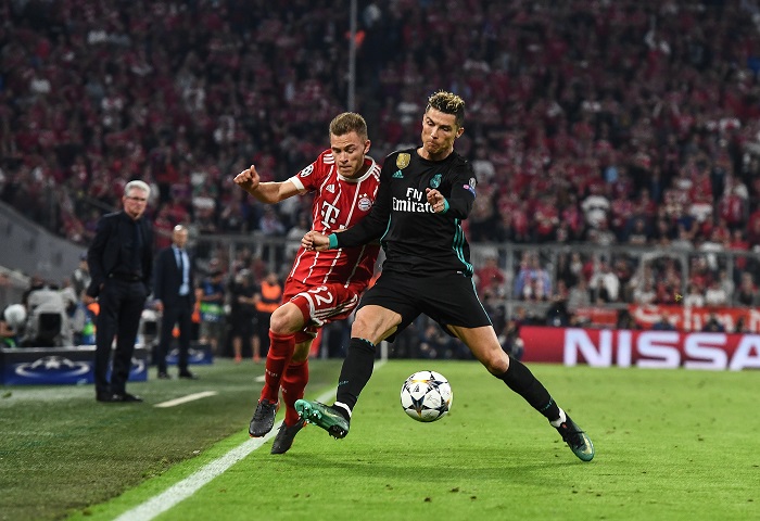 Bayern's Joshua Kimmich in action against Real Madrid’s Cristiano Ronaldo.