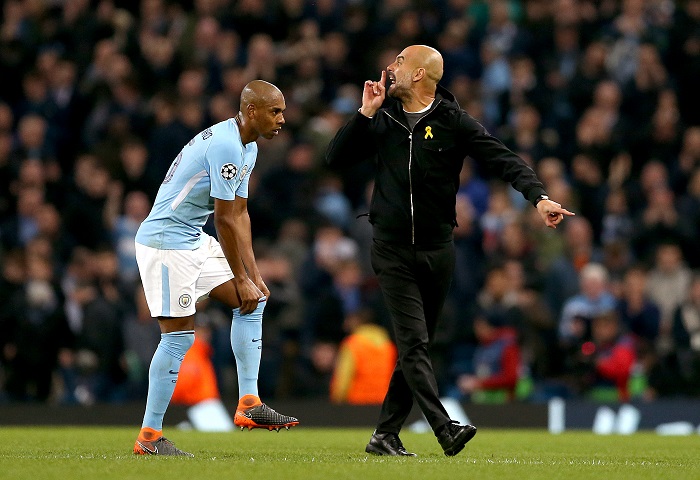 Manchester City manager Pep Guardiola speaks to the match referee (not in picture) at half-time