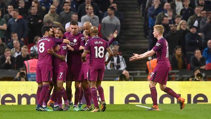 Manchester City celebrate their third goal.