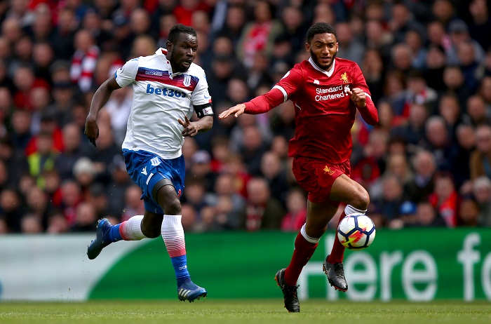 Stoke City's Mame Biram Diouf and Liverpool's Joe Gomez battle for the ball