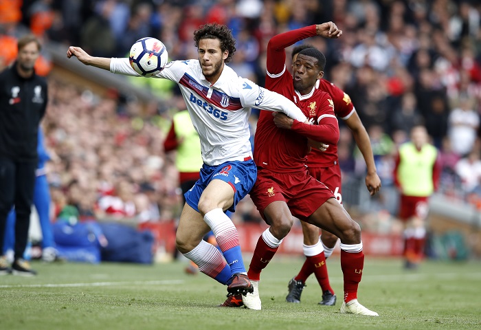 Stoke City's Ramadan Sobhi and Liverpool's Georginio Wijnaldum battle for the ball during the Premier League match at Anfield.