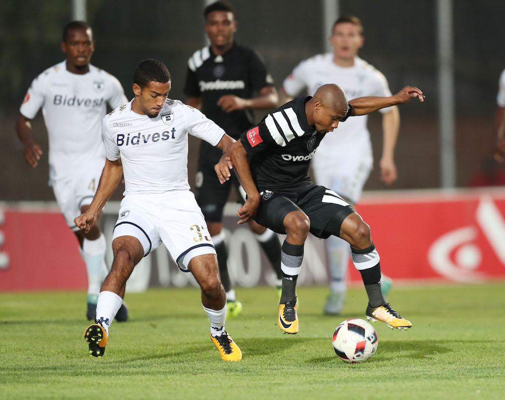 Thabo Qalinge challenged by Reeve Frosler