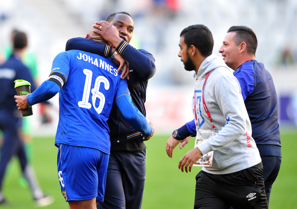 Benni McCarthy hugs his captain Robyn Johannes