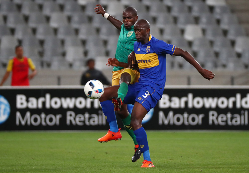 Lerato Lamola battles for the ball with Kwanda Mngonyama