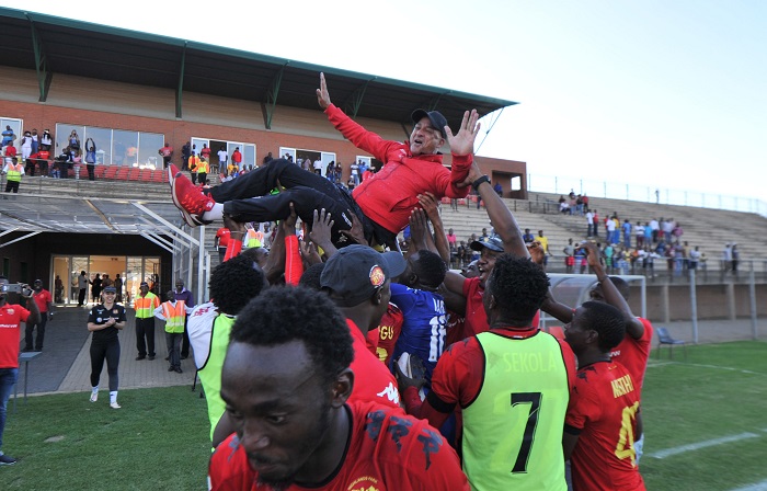 Owen Da Game coach of Highlands Park celebrates with the Team after securing the title.