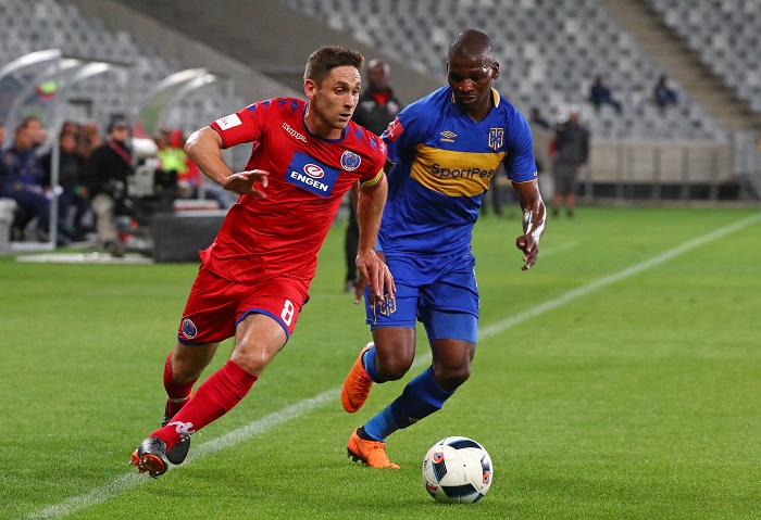 Dean Furman of Supersport United evades challenge from Thamsanqa Mkhize of Cape Town City.