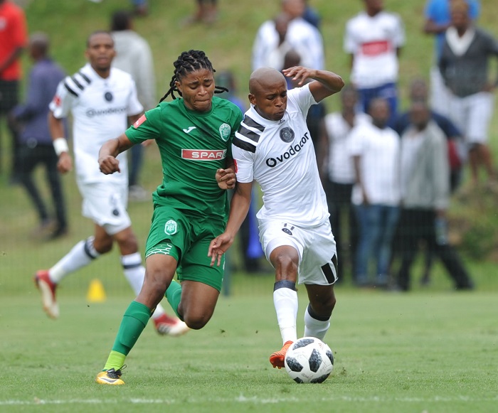 Siyethemba Mnguni of AmaZulu challenges Luvuyo Memela of Orlando Pirates.