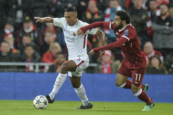 Roma's Juan Jesus and Liverpool's Mohamed Salah in action.