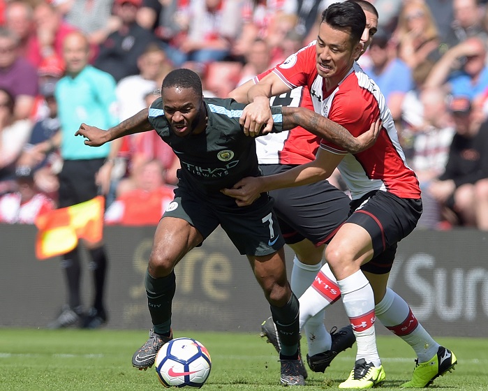 Maya Yoshida from Southampton vies for the ball against Manchester City winger Raheem Sterling.