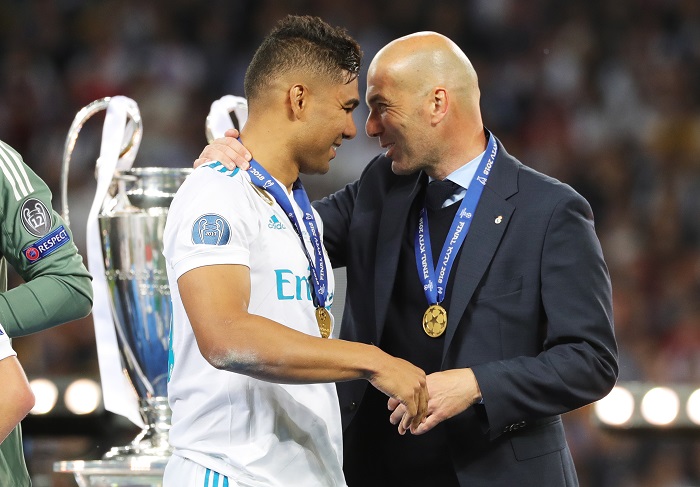 Real Madrid coach Zinedine Zidane and Casemiro with the Champions League trophy