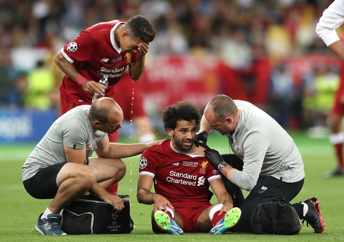 Liverpool's Mohamed Salah reacts after picking up an injury during the UEFA Champions League Final.