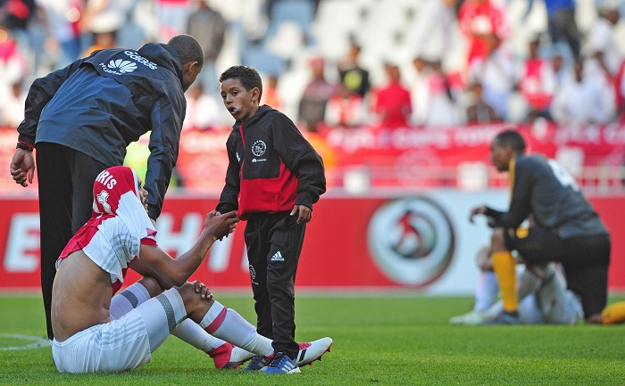 Tashreeq Morris of Ajax Cape Town is consoled by Ajax Cape Town ball boy after the game against Kaizer Chiefs.