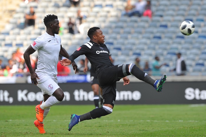 Happy Jele of Orlando Pirates challenges Siphelele Mthembu of Free State Stars.