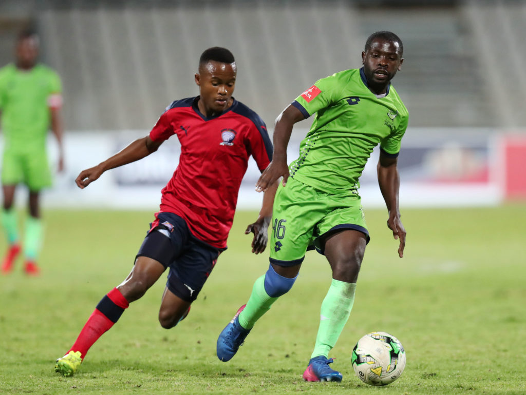 Tebogo Tlolane challenges Wangu Gome for the ball