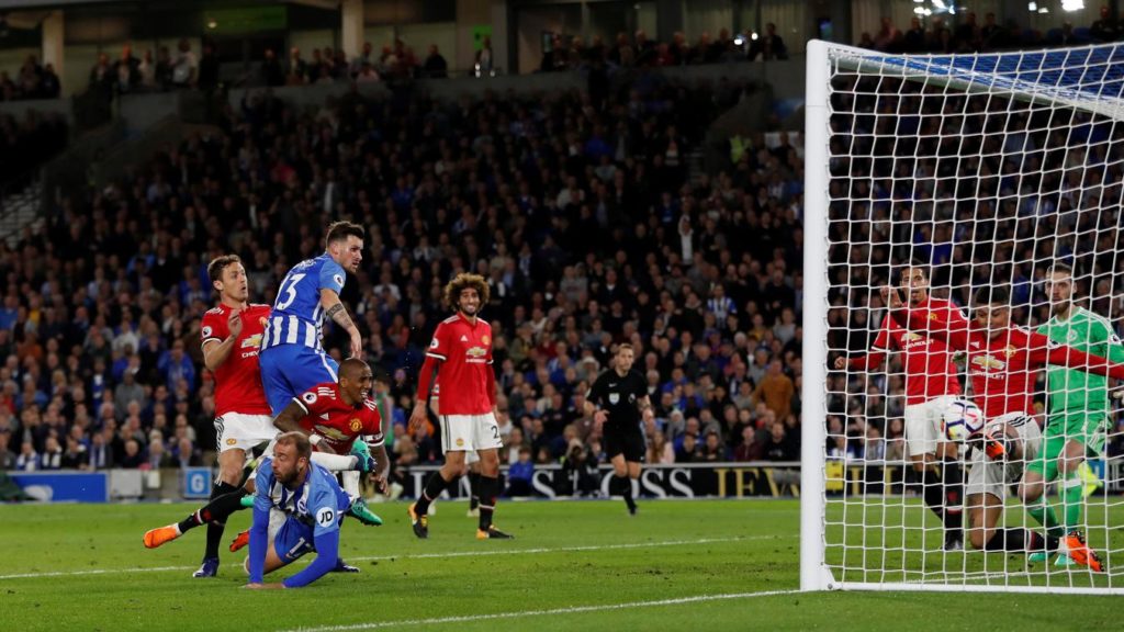 Marcos Rojo is too late to block Pascal Gross' header