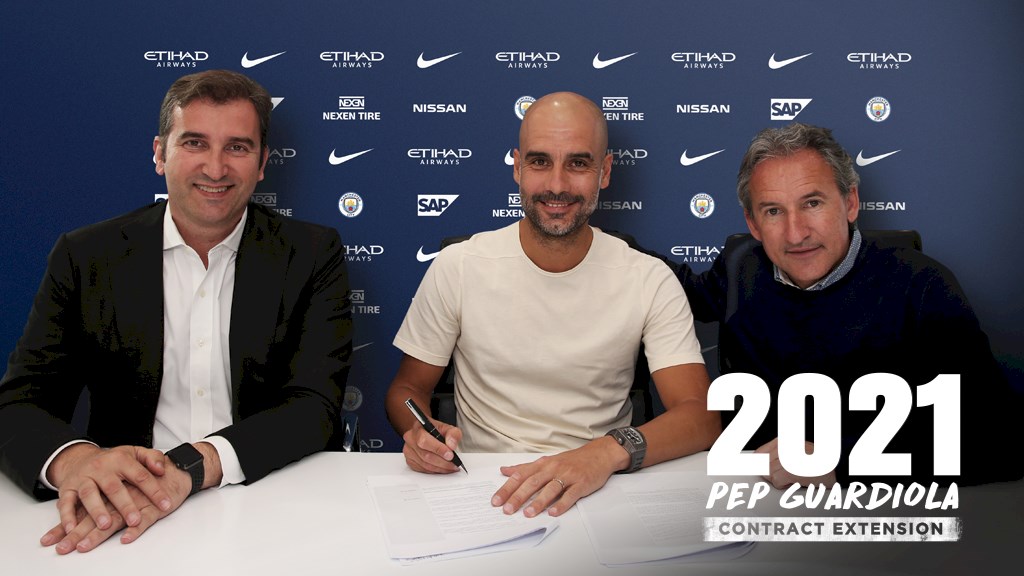 Pep Guardiola signing a contract extension at Manchester City