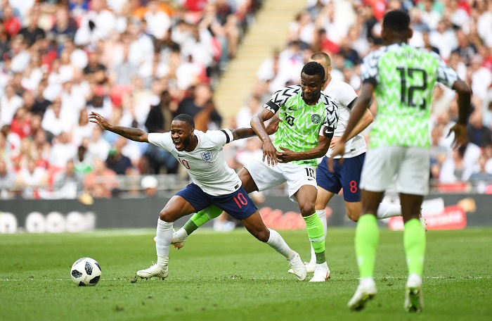 Raheem Sterling of England in action against Nigeria's John Obi Mikel.