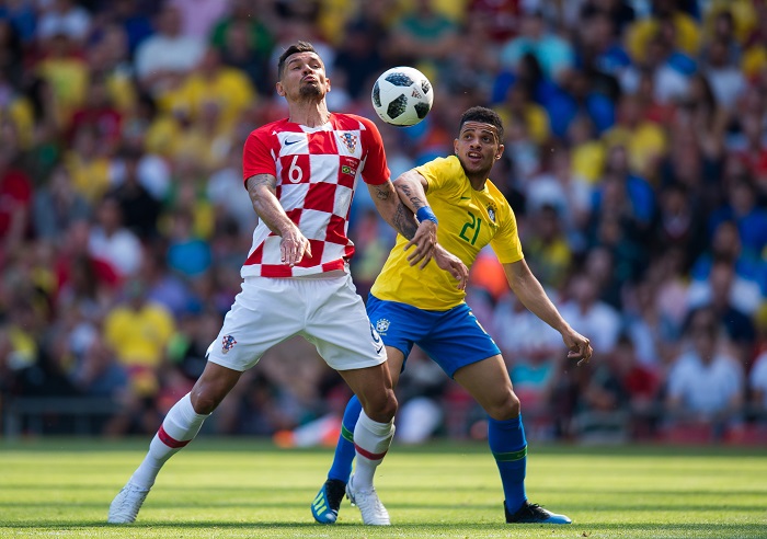 Brazil's Taison in action with Croatia’s Dejan Lovren.